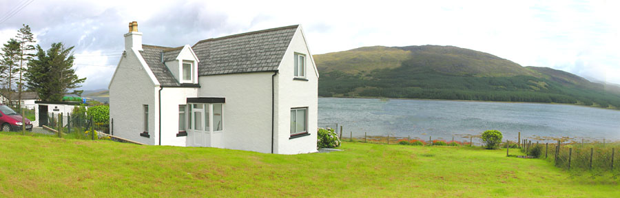 The cottage showing parking and sea views to Scalpay